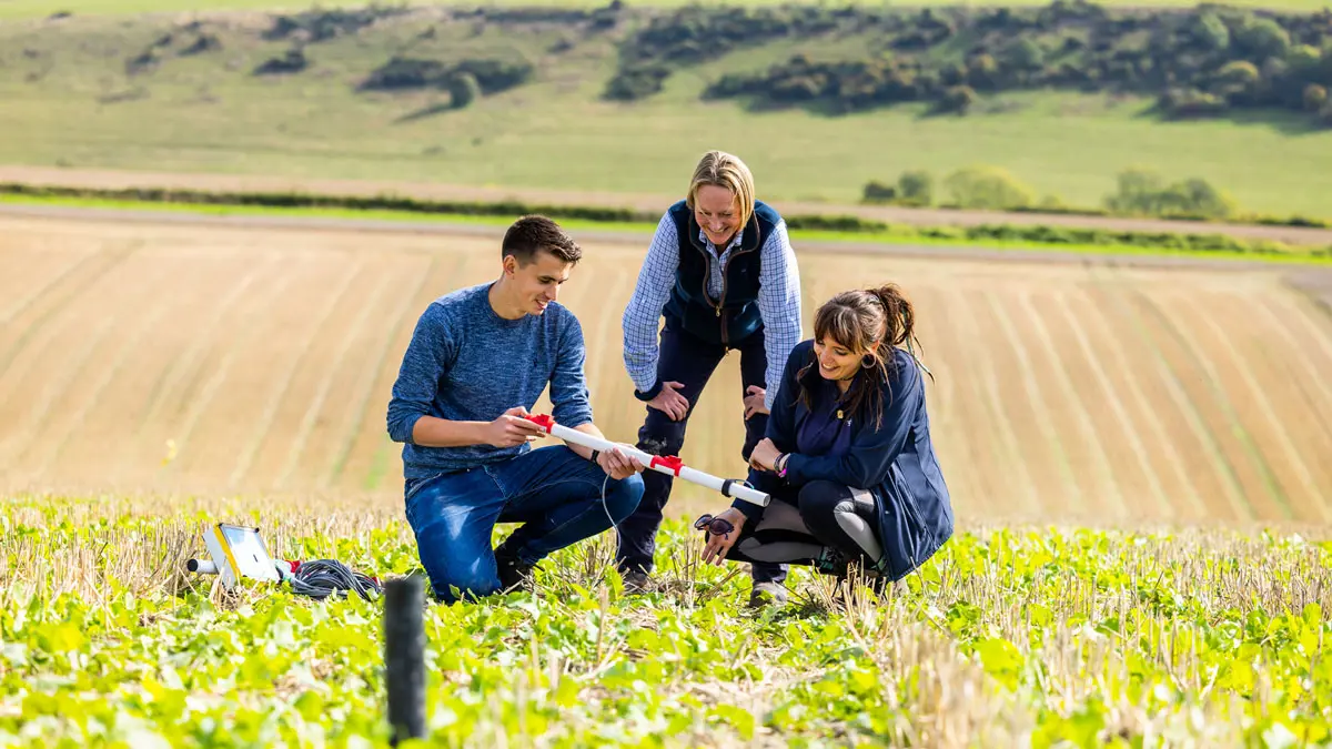 3 members of the catchment team using a Nitrate Sensor