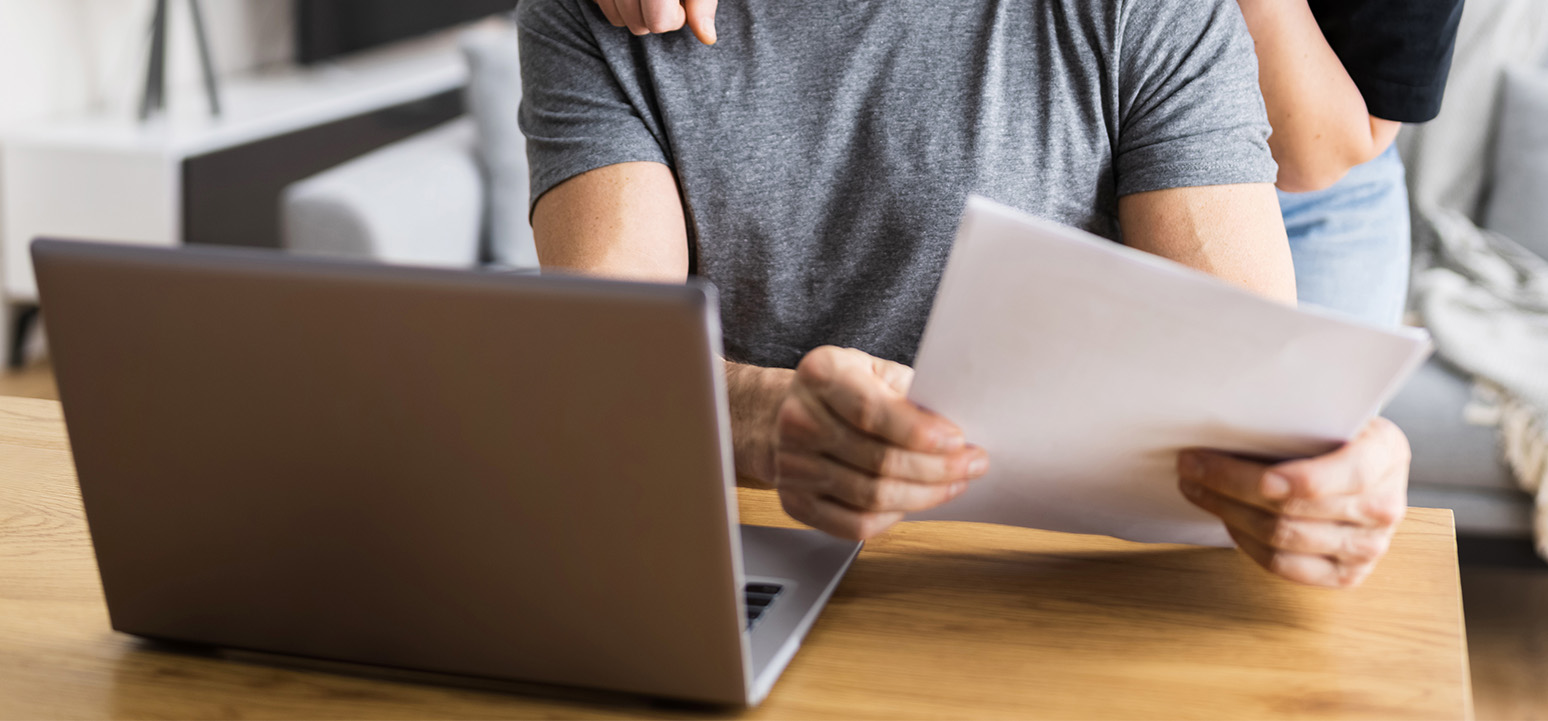 Person paying bill on laptop