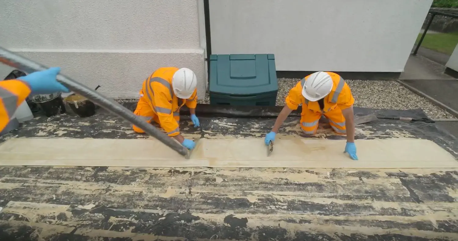 Two men preparing the sewer lining