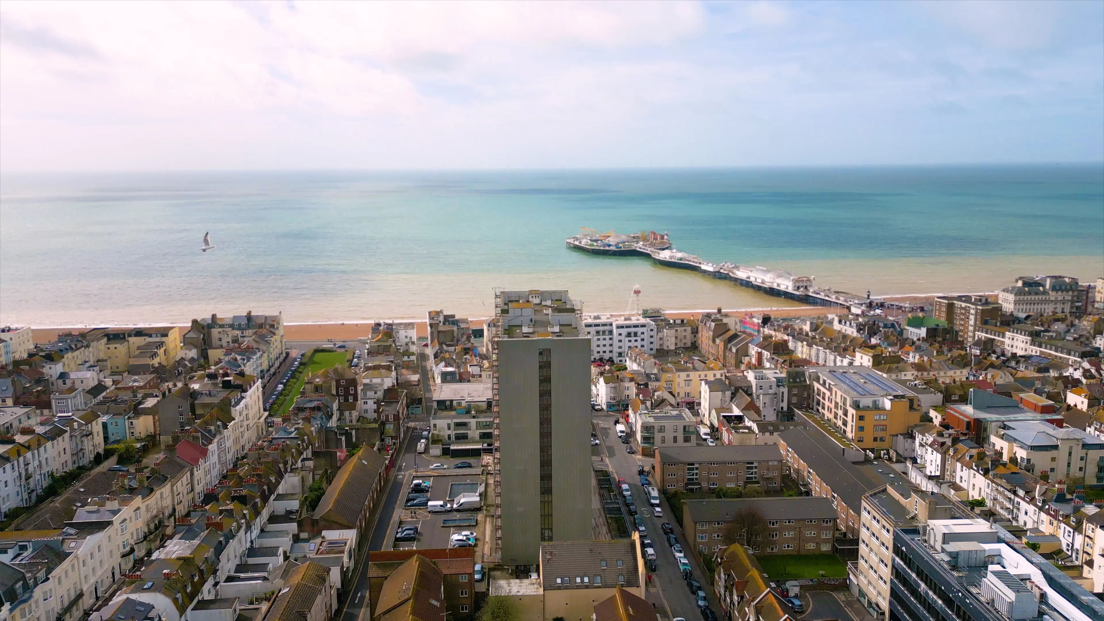 Ariel view of a seaside town with pier 