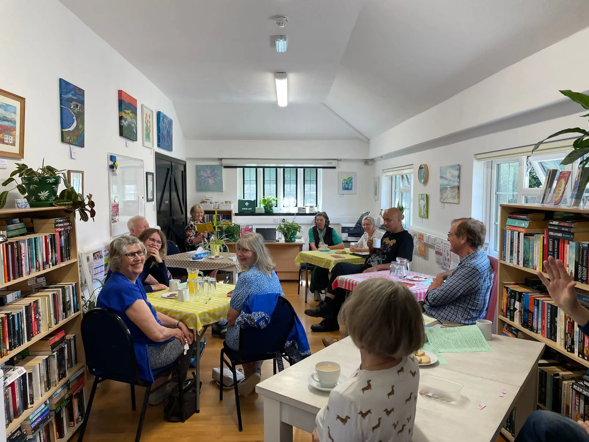 Group of people having tea in a community centre making use of their Southern Water grant